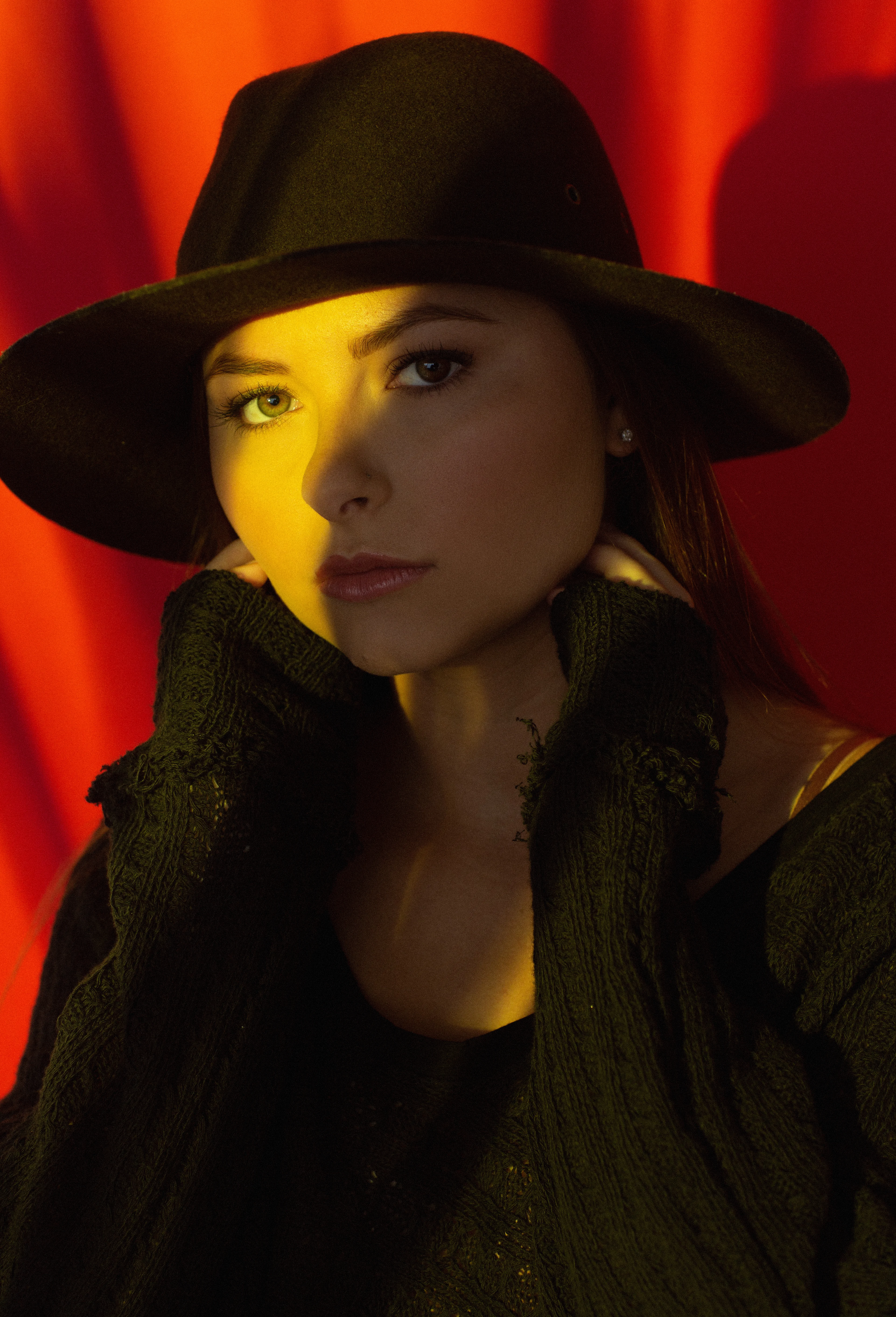 Dramatic red background studio portrait
